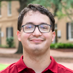 boy with glasses smiling