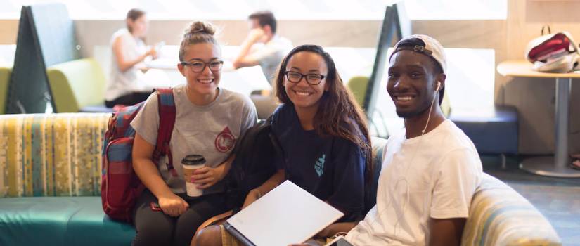 Students sitting on a couch at Russell House