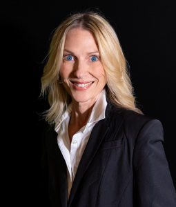 woman with blond hair and black jacket on