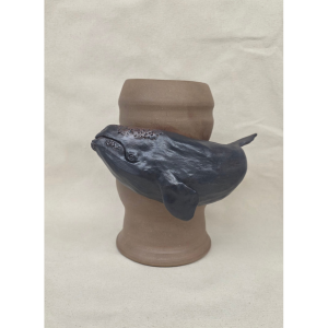 Photo of a ceramic vessel with a whale 