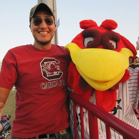 Ari Perez poses with Cocky