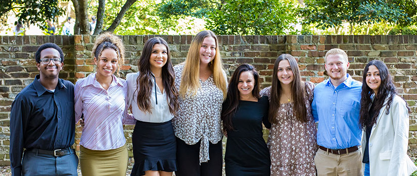 Tepper Scholars cohorts stand with Nicole Tepper at the historic Horseshoe.