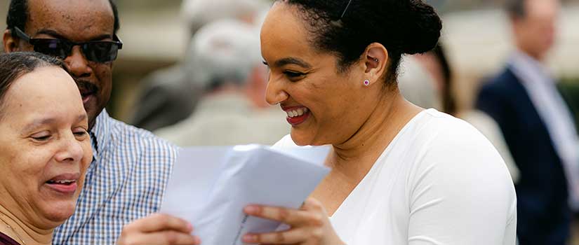 Excited student shares her residency match letter with her parents.