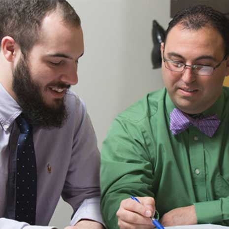 Financial aid counselor reviews a document with medical student