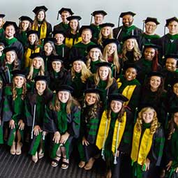 Group of M4 students in adademic regalia at convocation.