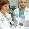 Professor with medical students intubate a simulated patient