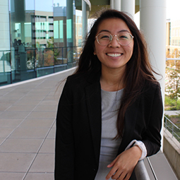 Portrait of Amy Linh next to the Moore School