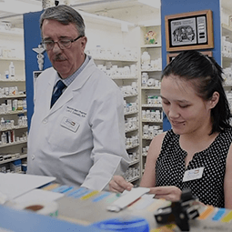 pharmacist behind a counter