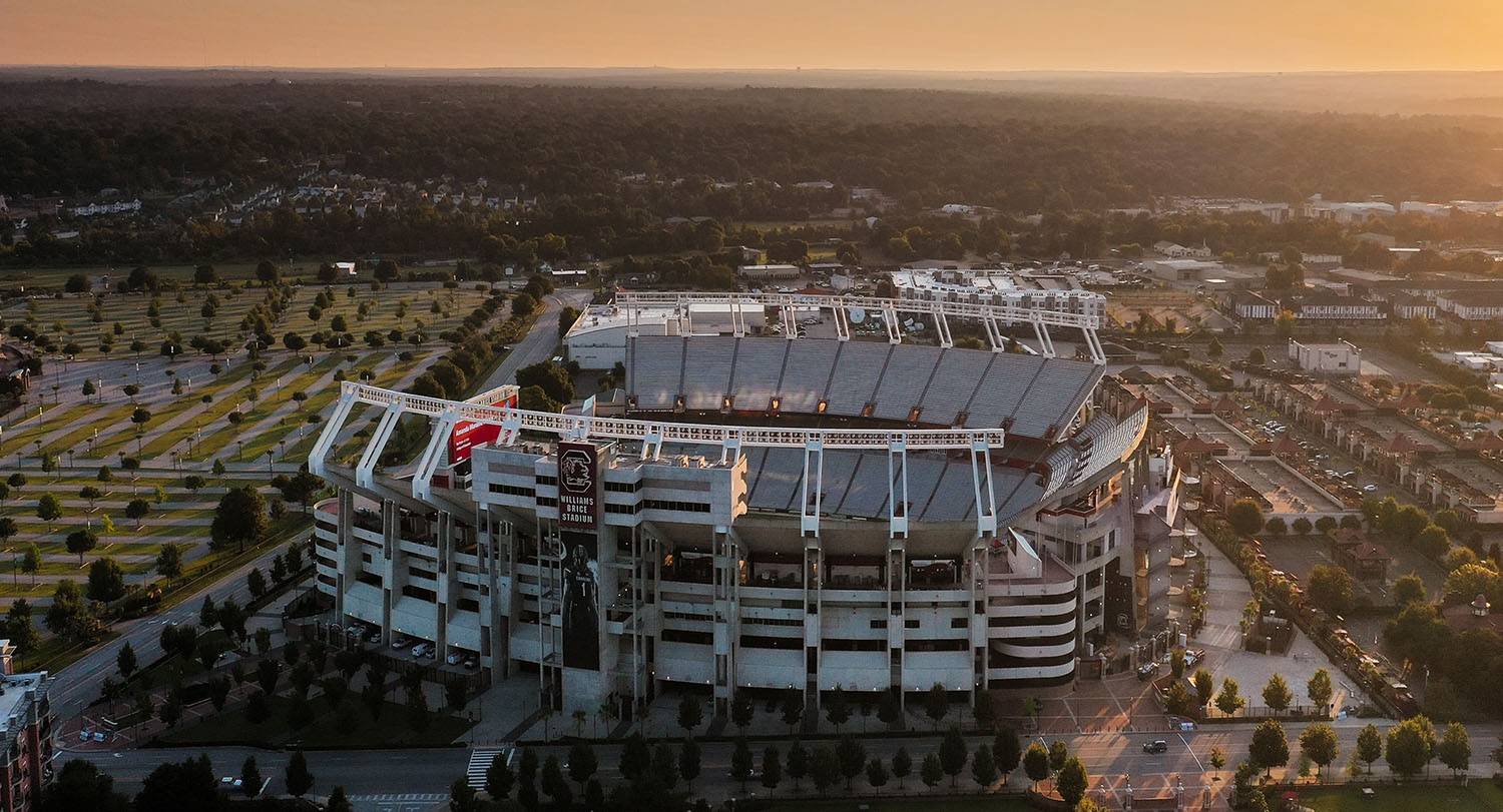 Williams-Brice football stadium empty under a sunset