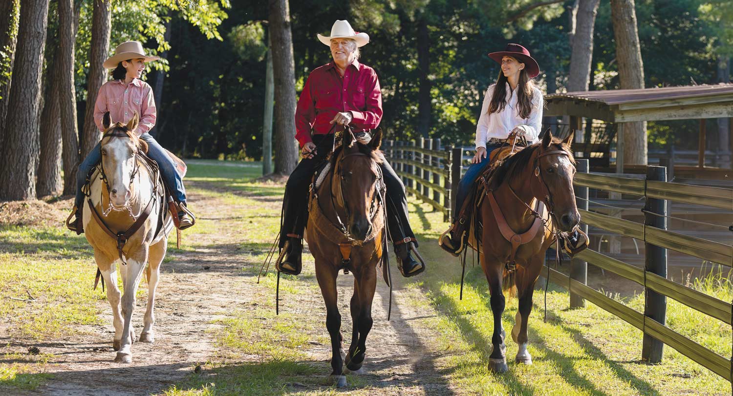 Joe Rice, center, enjoys an early evening amble through the woods at Awendaw with grandson Beckett, left, and daughter, Ann E. Rice Ervin.