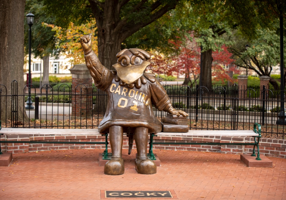 Cocky statue with bench on the USC campus.