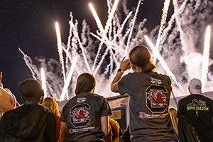 Students watching the fireworks over the Russell House at First Night Carolina.