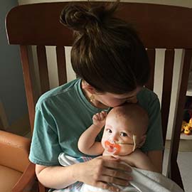 Sarah Ostenfeld hugs her daughter during one of their many hospital stays during Sarah's pharmacy school career.