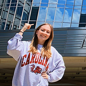 Emily Ariail wearing a Carolina sweatshirt.