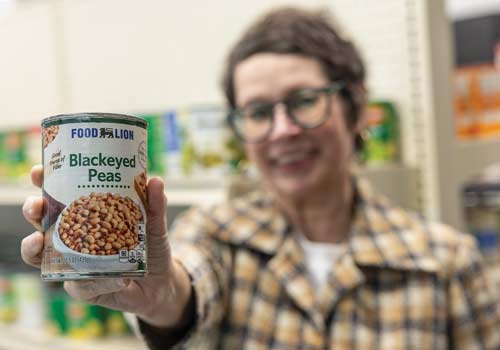 Rachel Brasell holds up a Food Lion brand of blackeyed peas