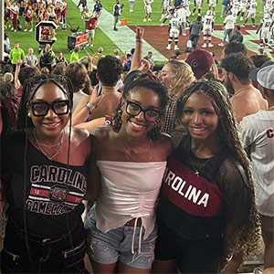 Ian Piihl Sierra Brent, center, with friends at football game
