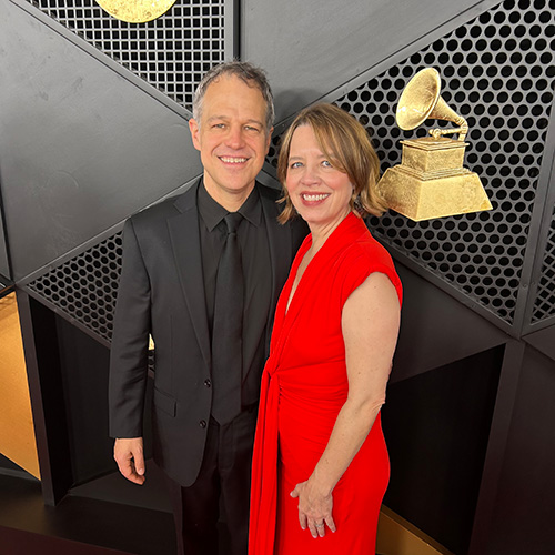 A couple pausing for photos at the Grammy Awards